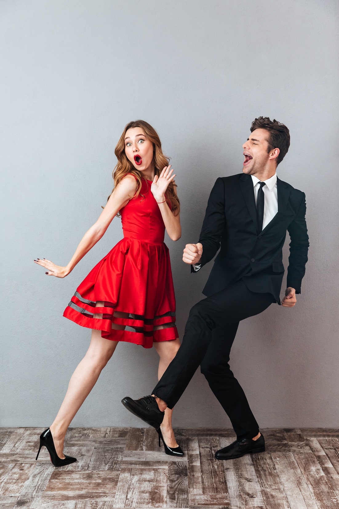 Full,Length,Portrait,Of,A,Happy,Excited,Couple,Dressed,In